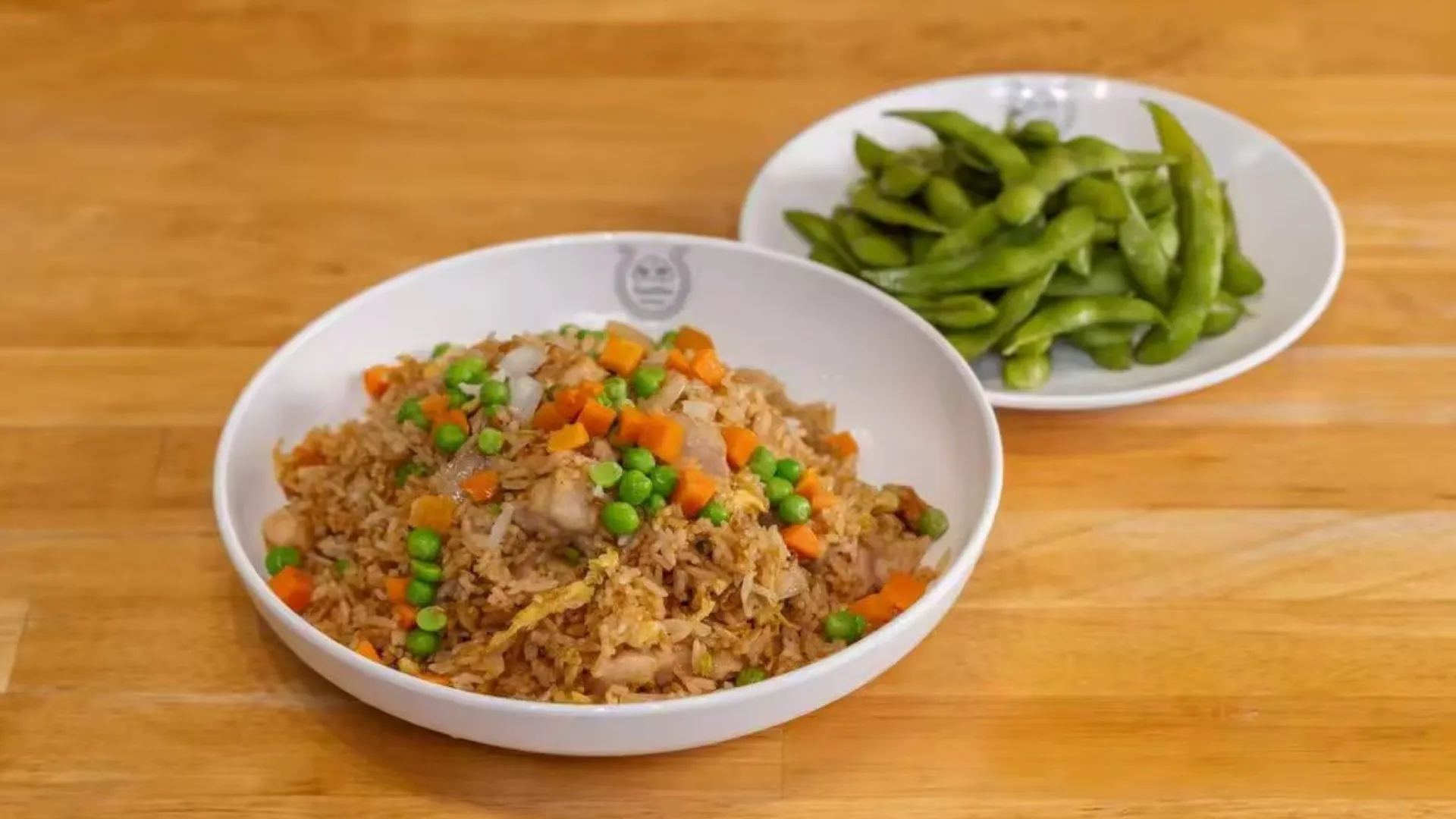 Chicken fried rice with edamame and edamame at TastiGo Kitchen, an Asian Fusion Restaurant in Miami