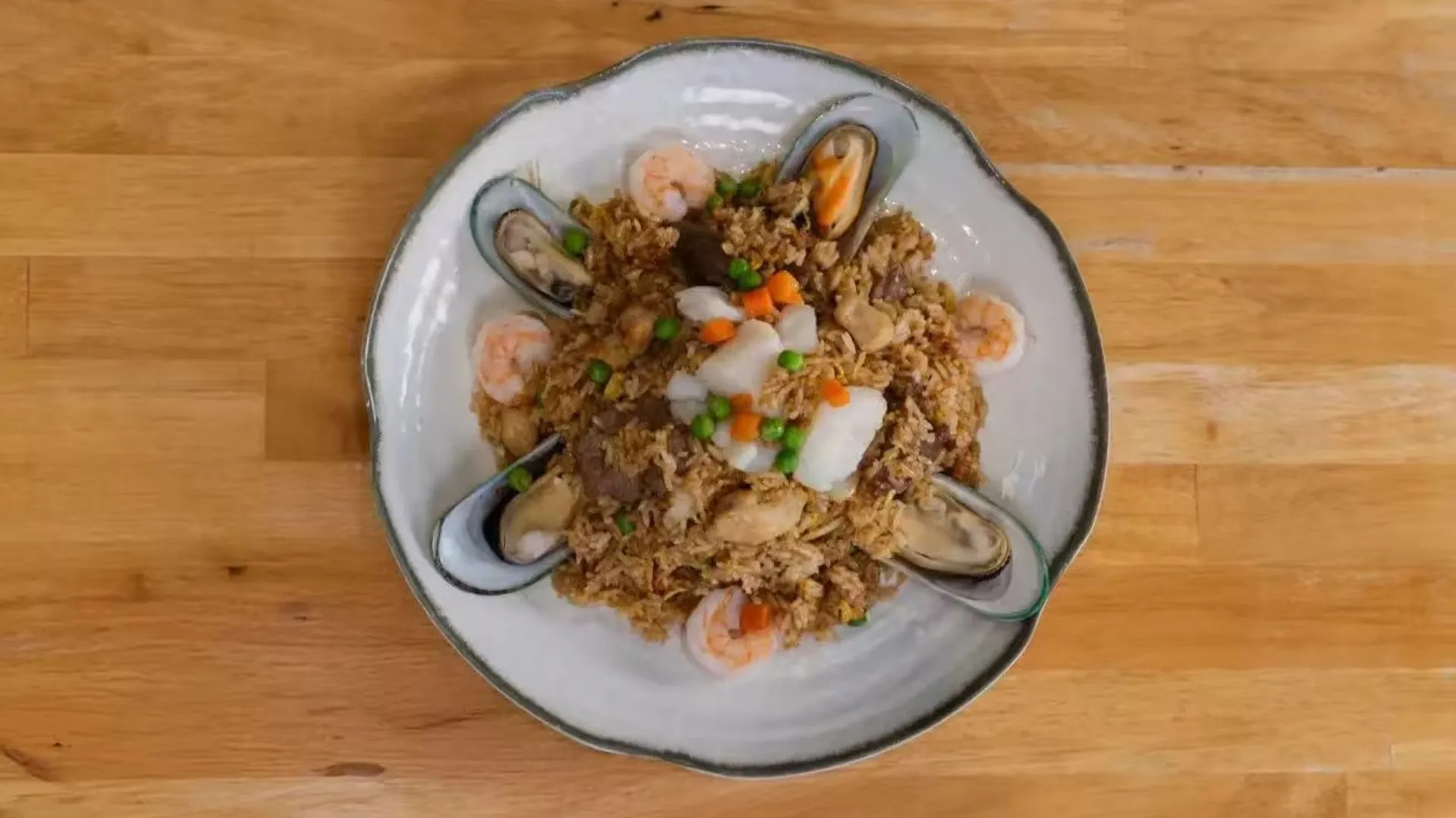 Seafood fried rice with shrimp and mussels at TastiGo Kitchen, an Asian Fusion Restaurant in Miami