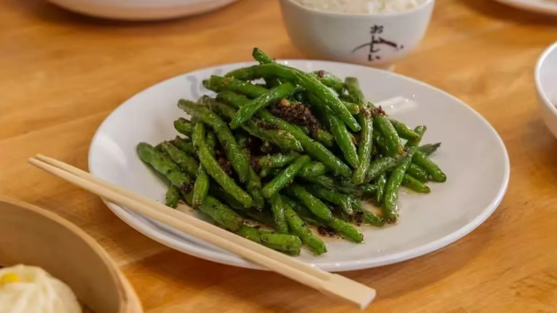 Savory stir fried green beans with garlic at TastiGo Kitchen, an Asian Fusion Restaurant in Miami